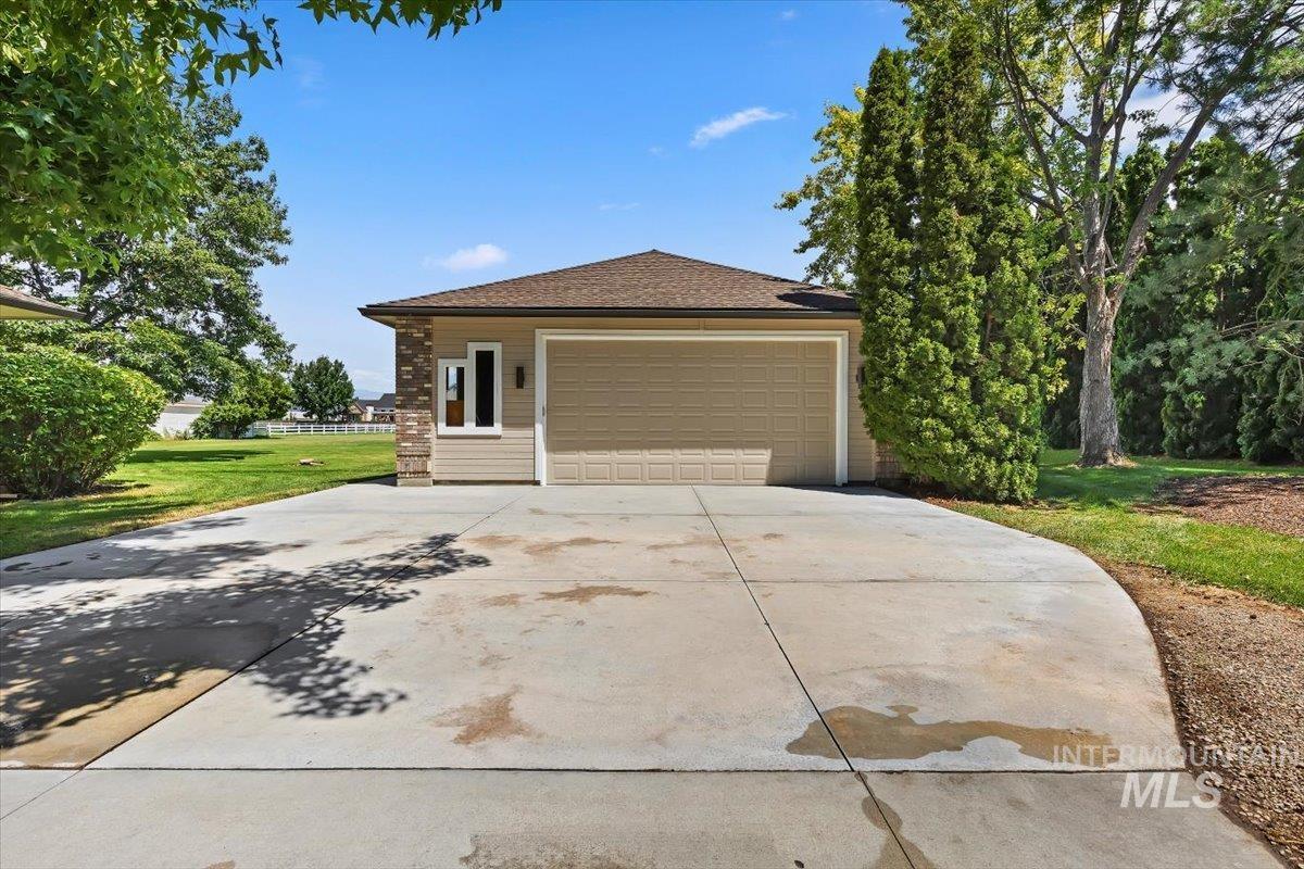 Exterior featuring a 30x40 shop with a panel garage door, full electric service w/220v.