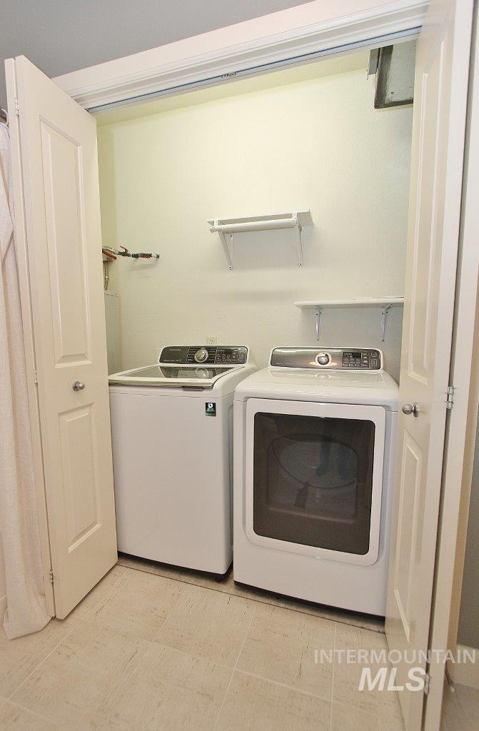 Laundry area featuring separate washer and dryer