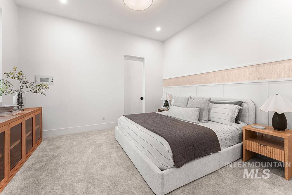 Bedroom featuring light colored carpet and recessed lighting