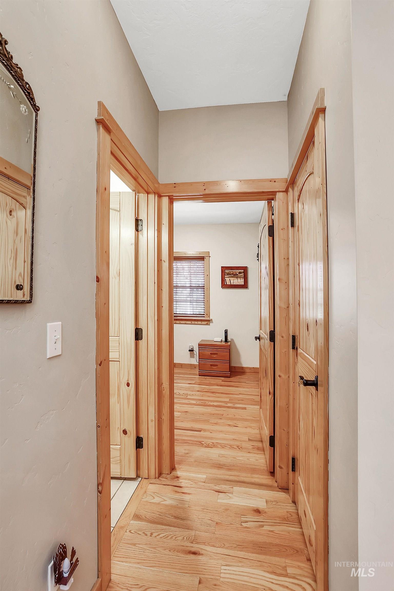 Corridor featuring light wood-type flooring