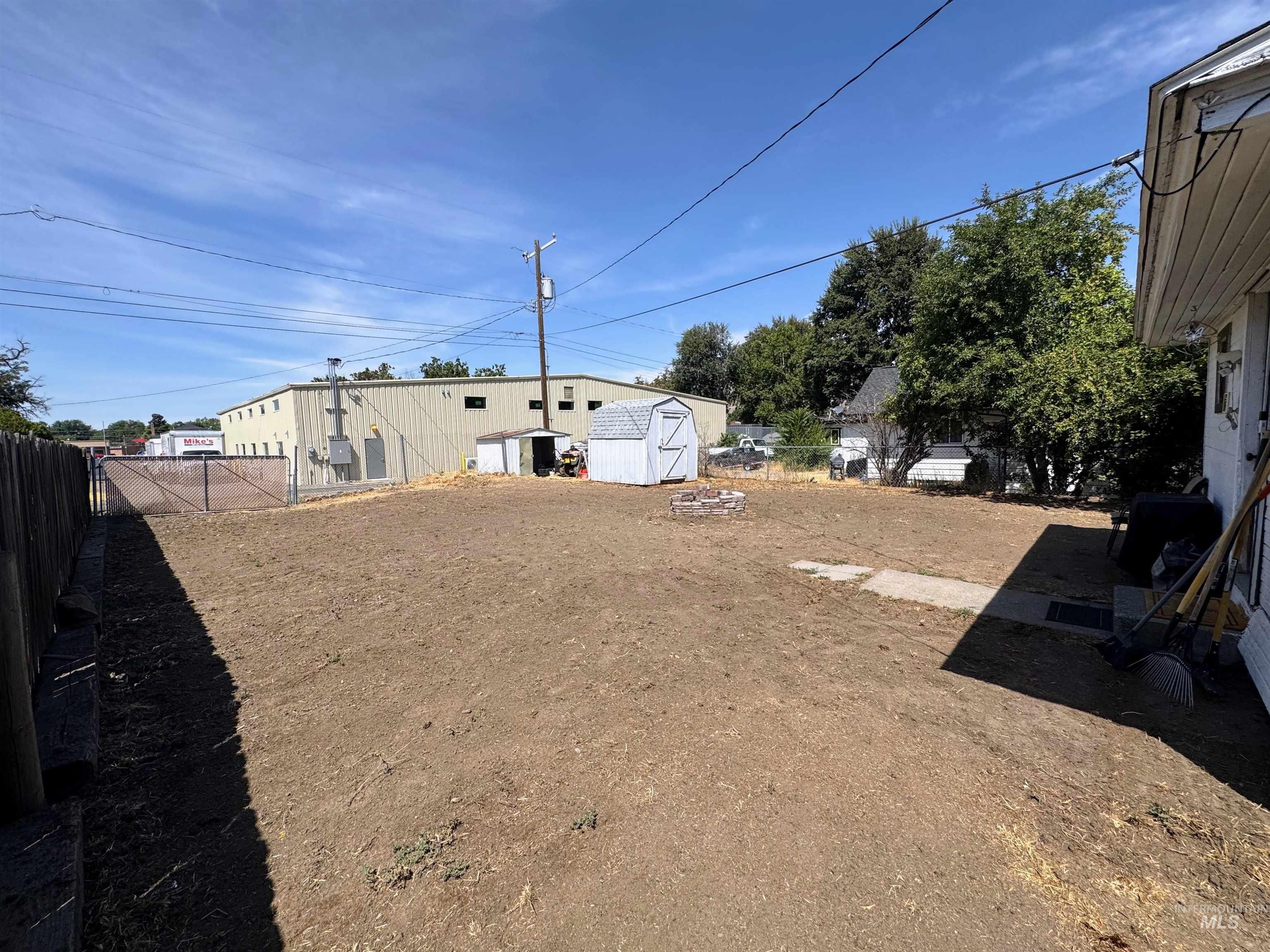 View of yard with a storage unit
