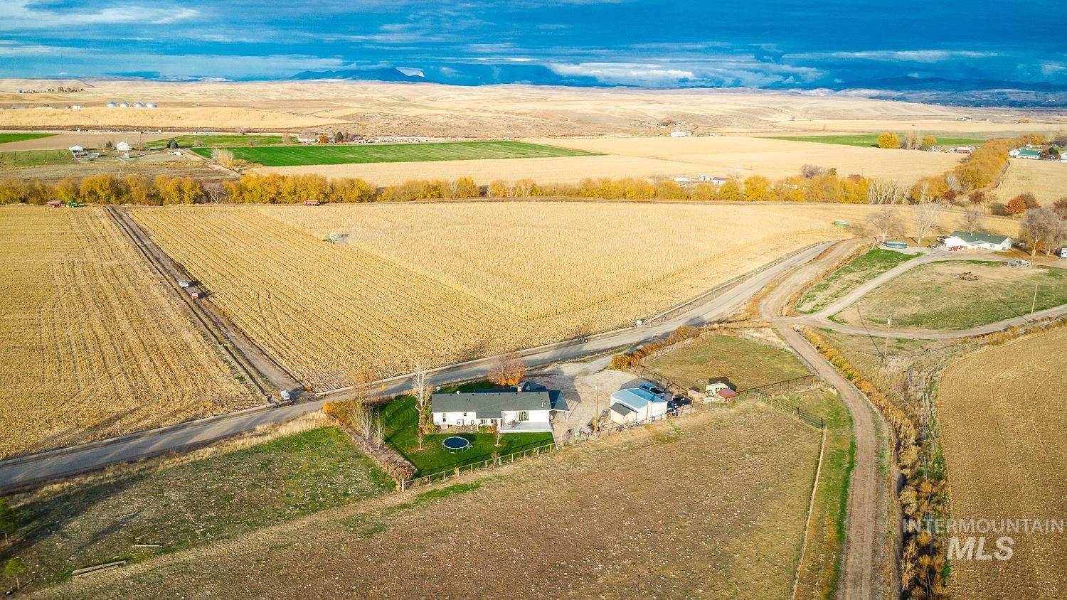 Aerial view of property and surrounding area with rural landscape and farmland