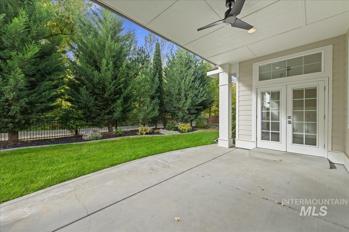 View of patio with a ceiling fan and french doors