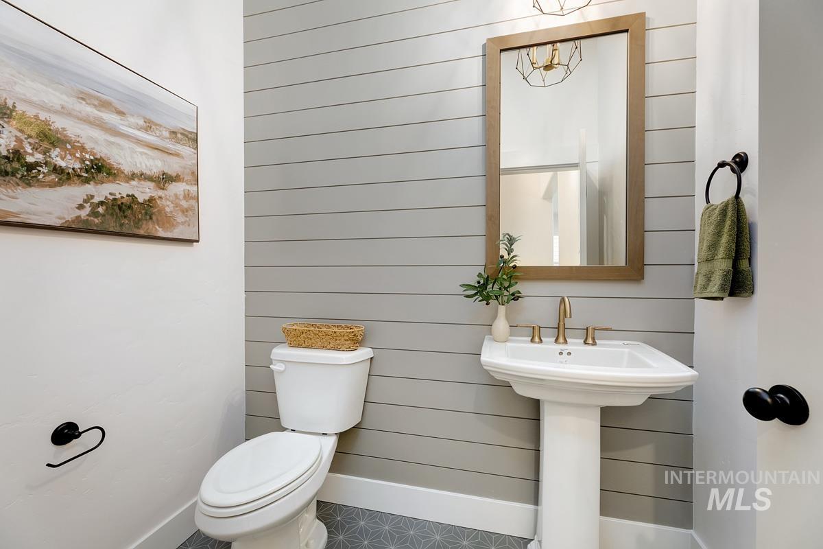 Bathroom featuring toilet and baseboards