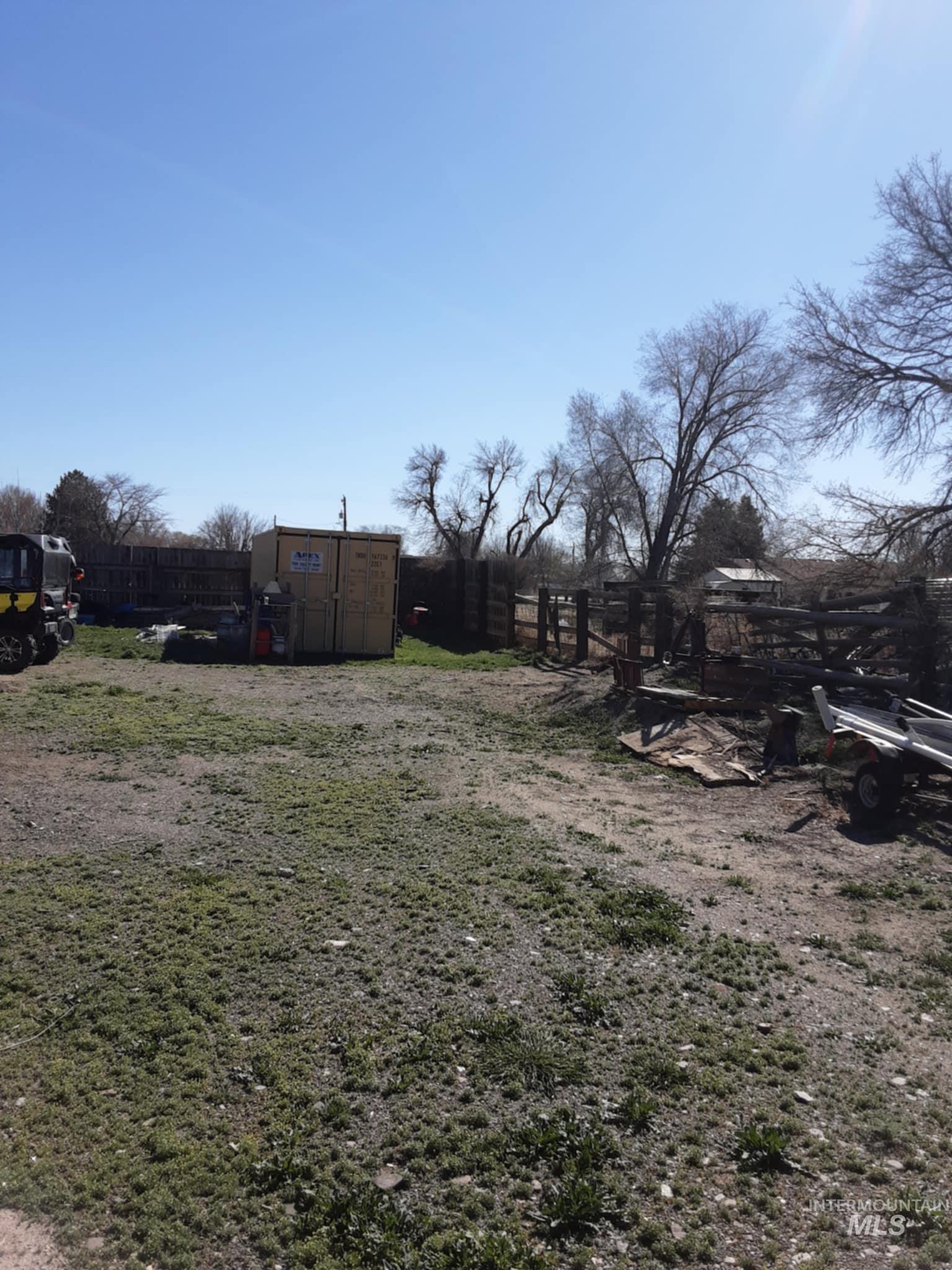 Fenced yard with a storage unit
