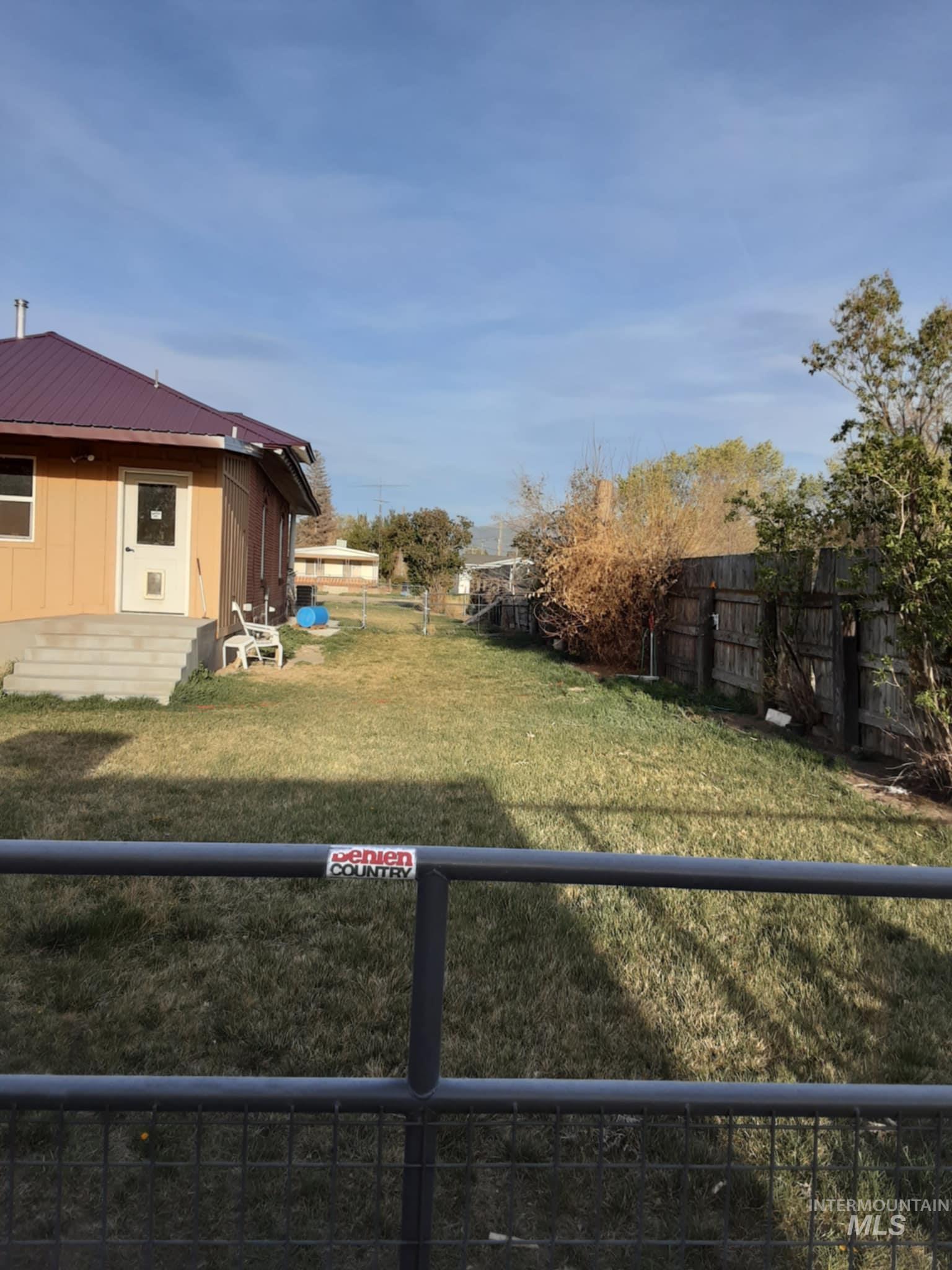 View of fenced backyard