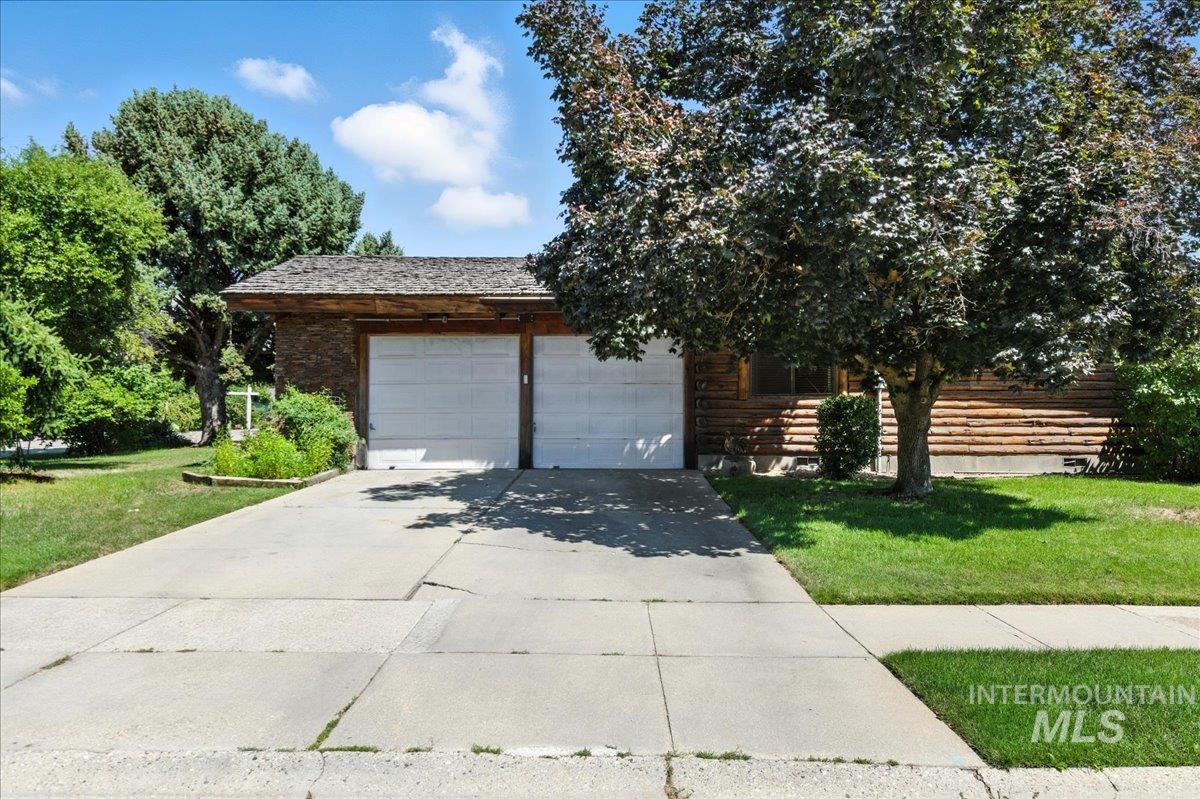 Garage side of house, far right is additional RV parking or extra vehicle parking.