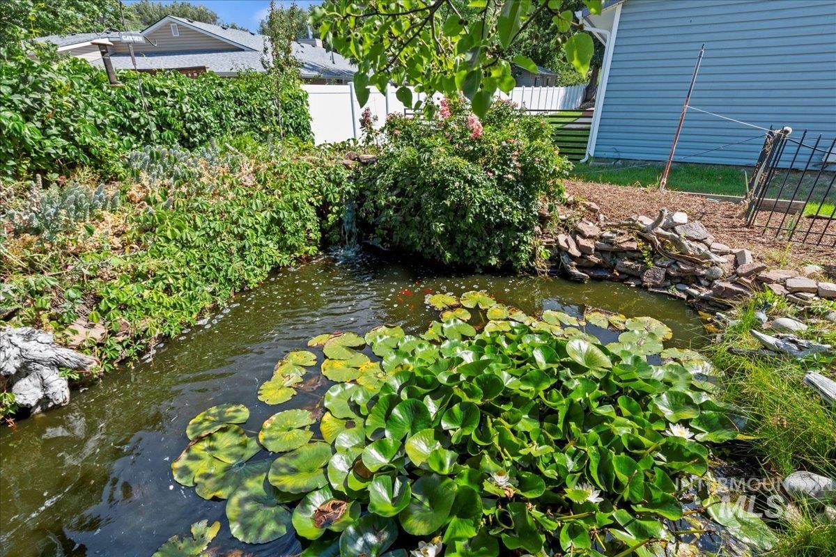 View of yard with a garden pond