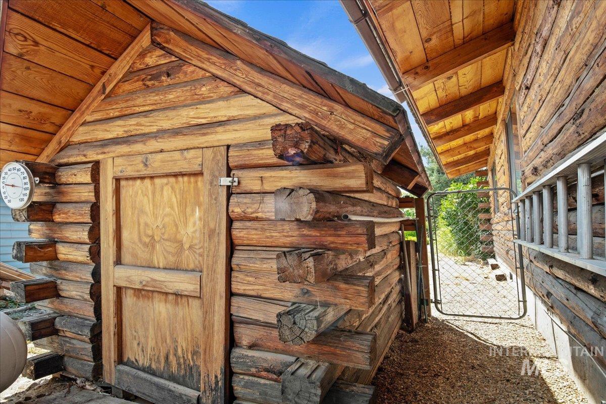 View of outbuilding with an exterior structure
