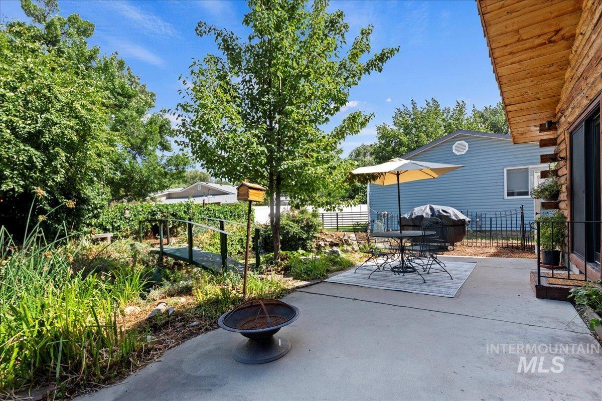 View of patio / terrace featuring an outdoor fire pit and outdoor dining area