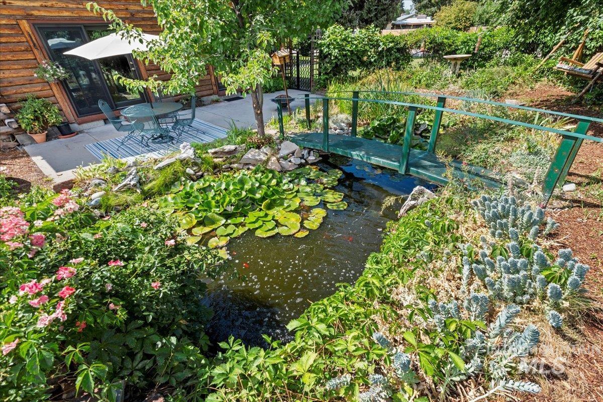 View of yard featuring a garden pond