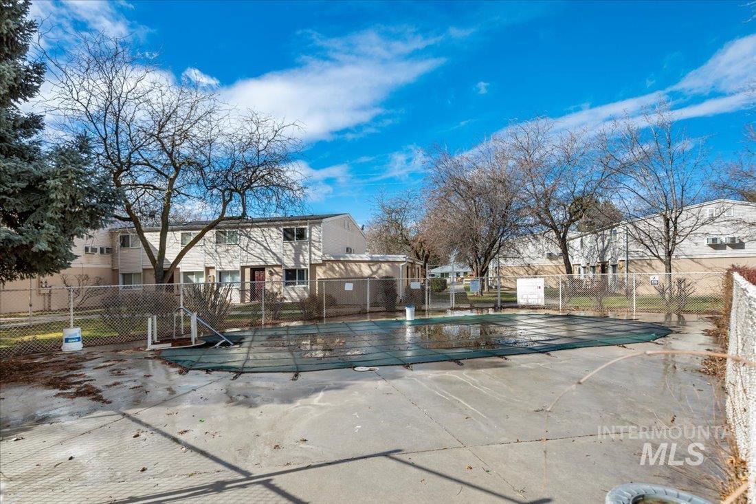 Community pool featuring a patio area