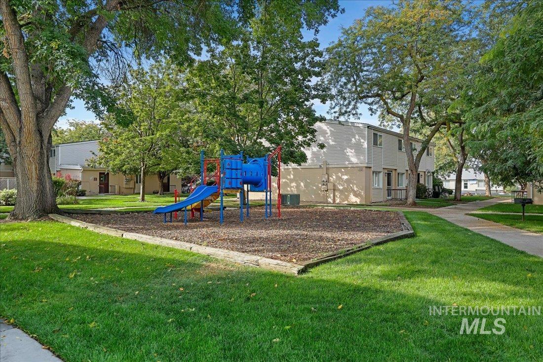 Communal playground featuring a yard