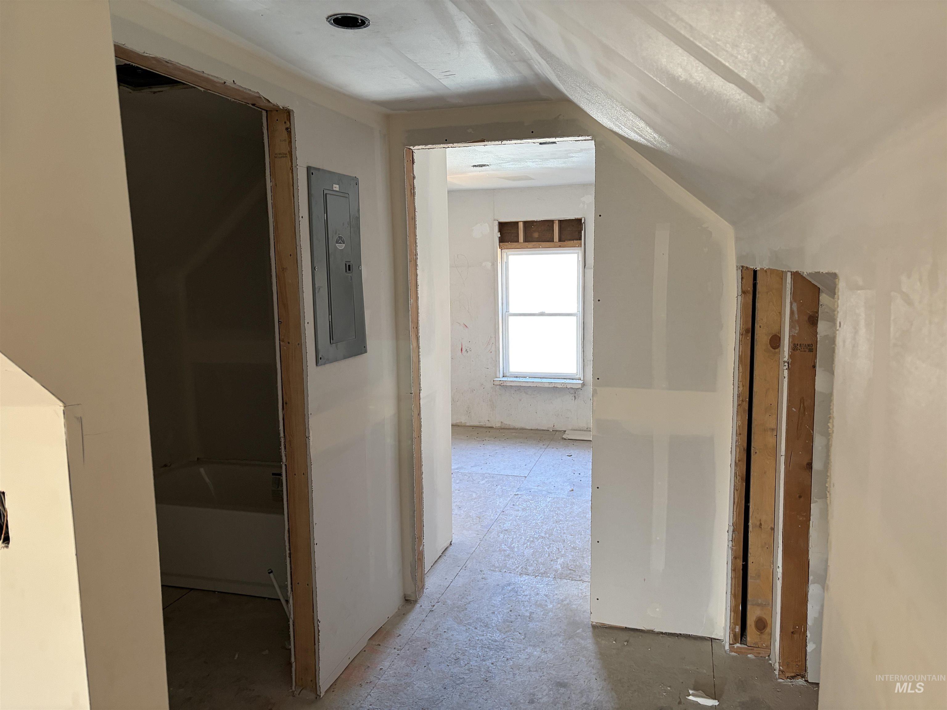 Hallway featuring electric panel