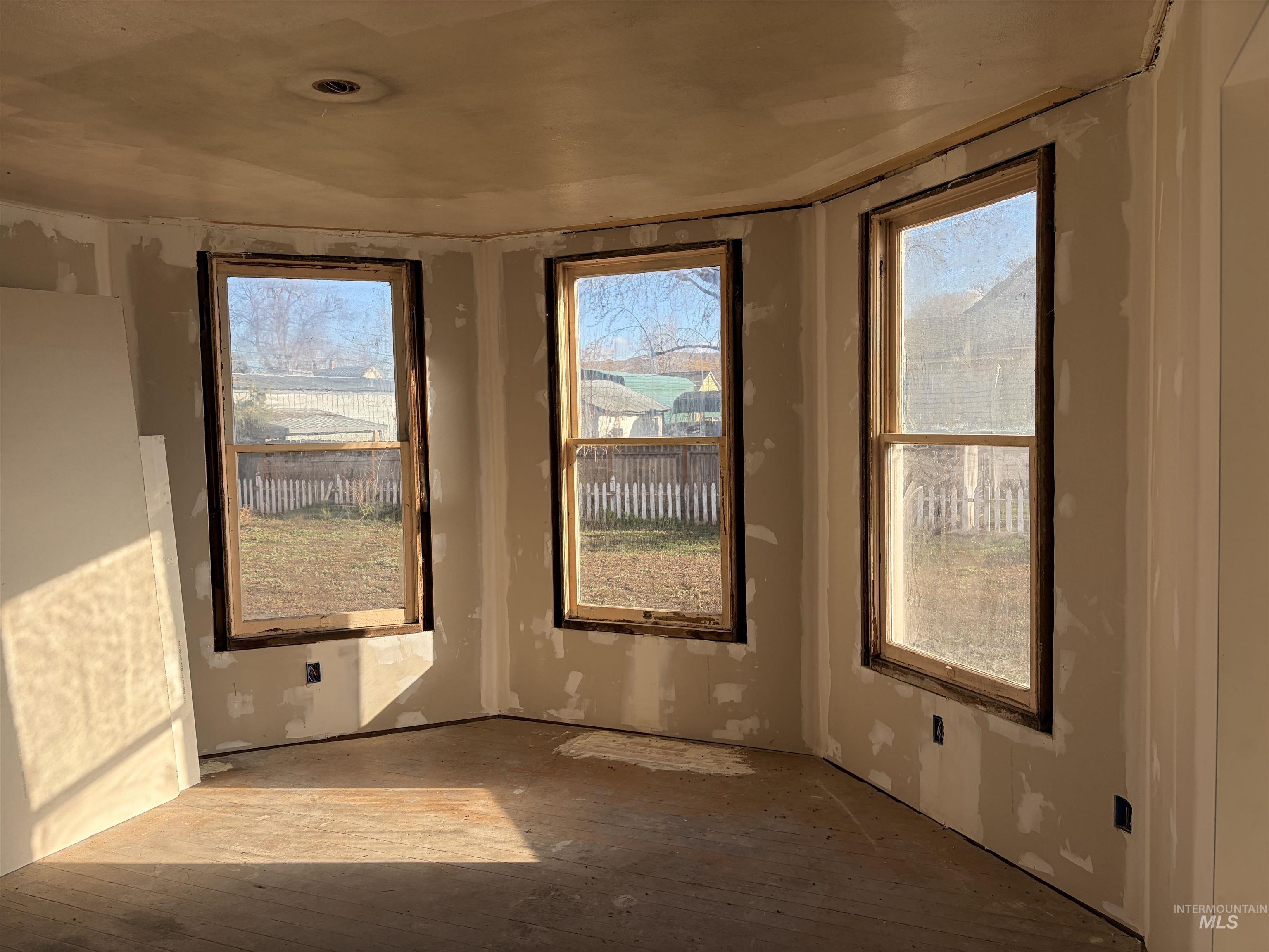 Empty room with wood-type flooring
