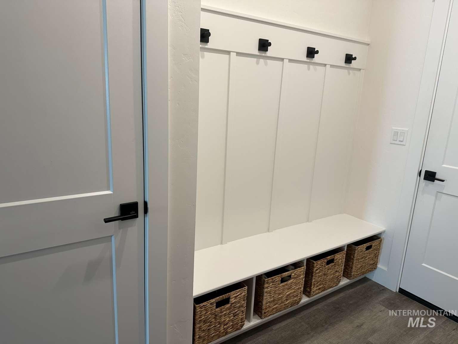 Mudroom featuring dark wood-type flooring