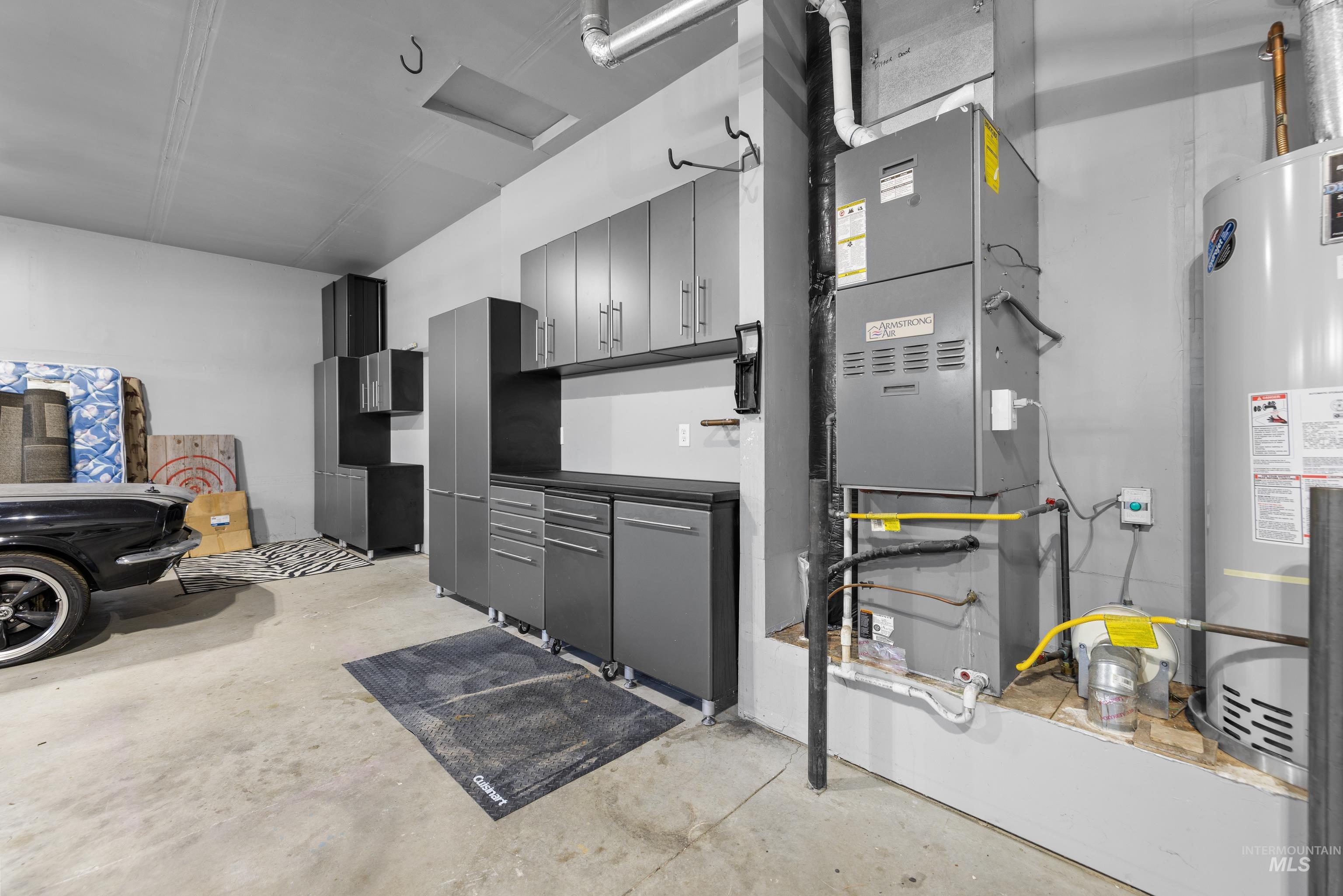 Garage with water heater and heating unit