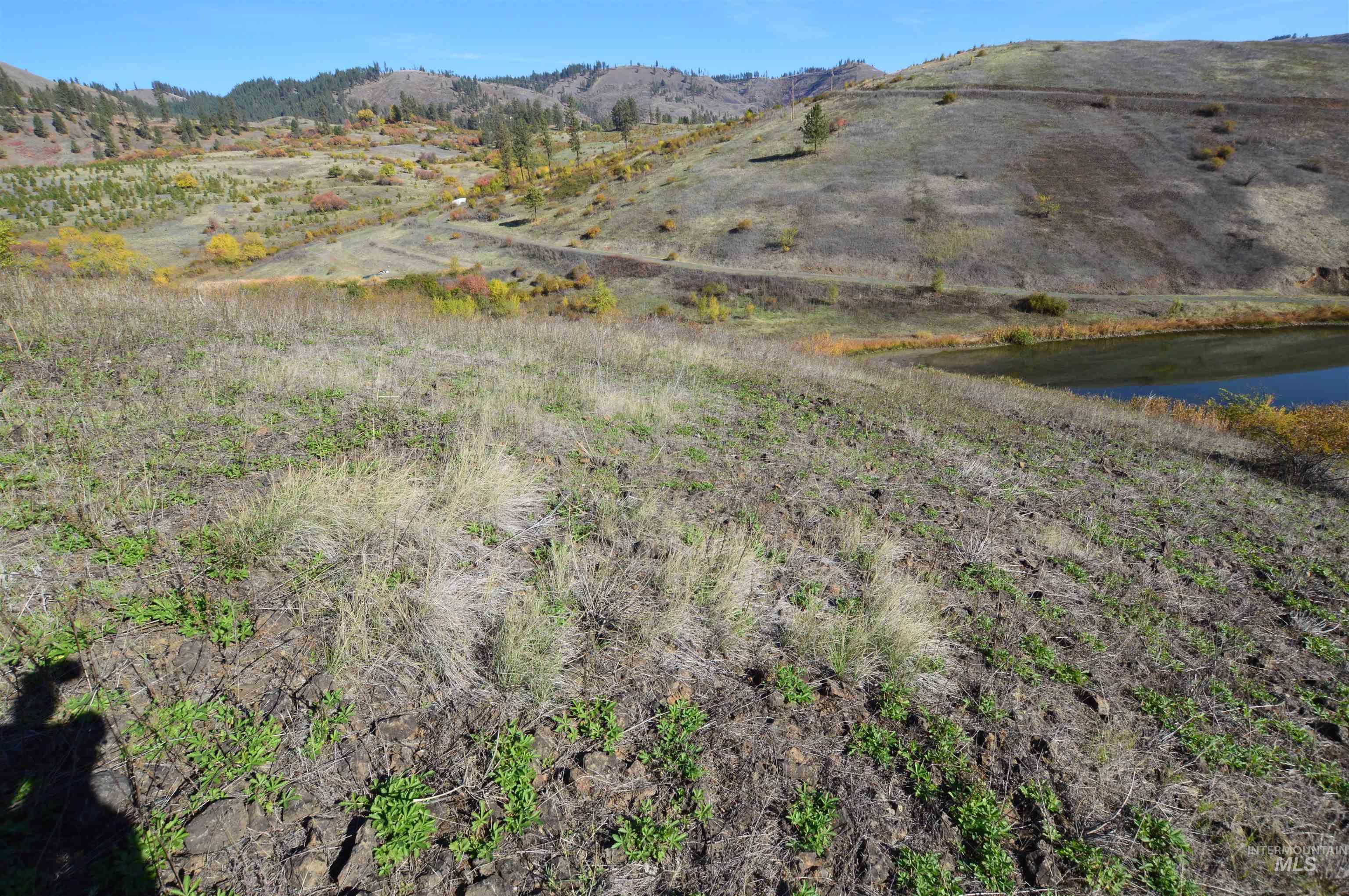 View of property location with a water and mountain view