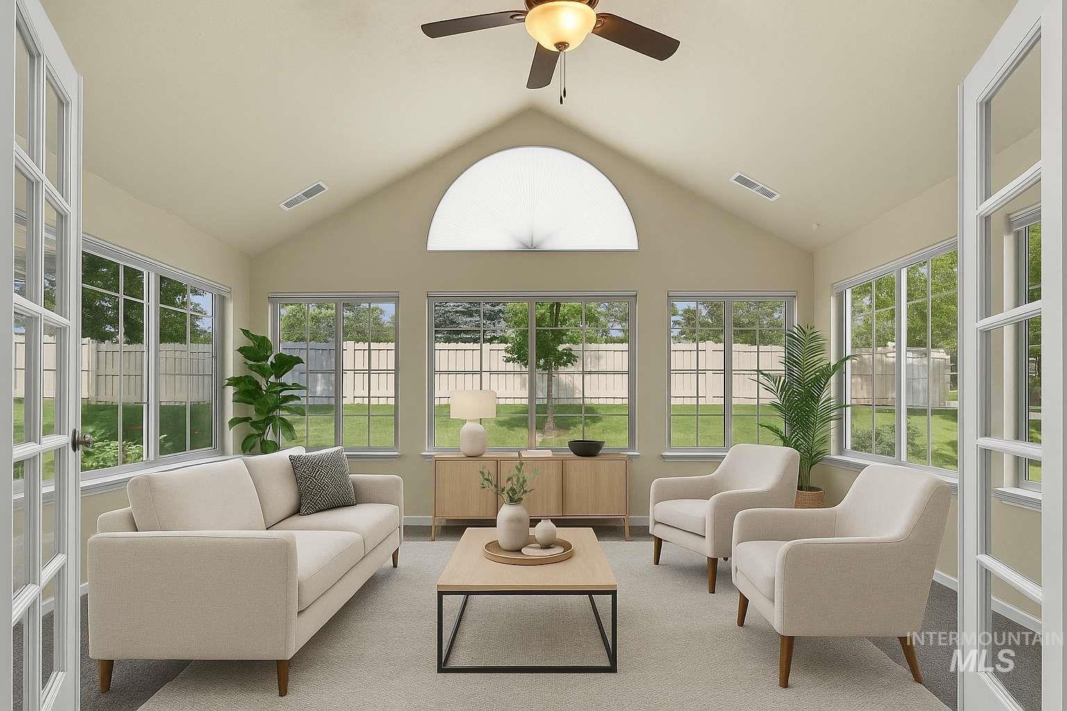 Sunroom / solarium with vaulted ceiling and plenty of natural light