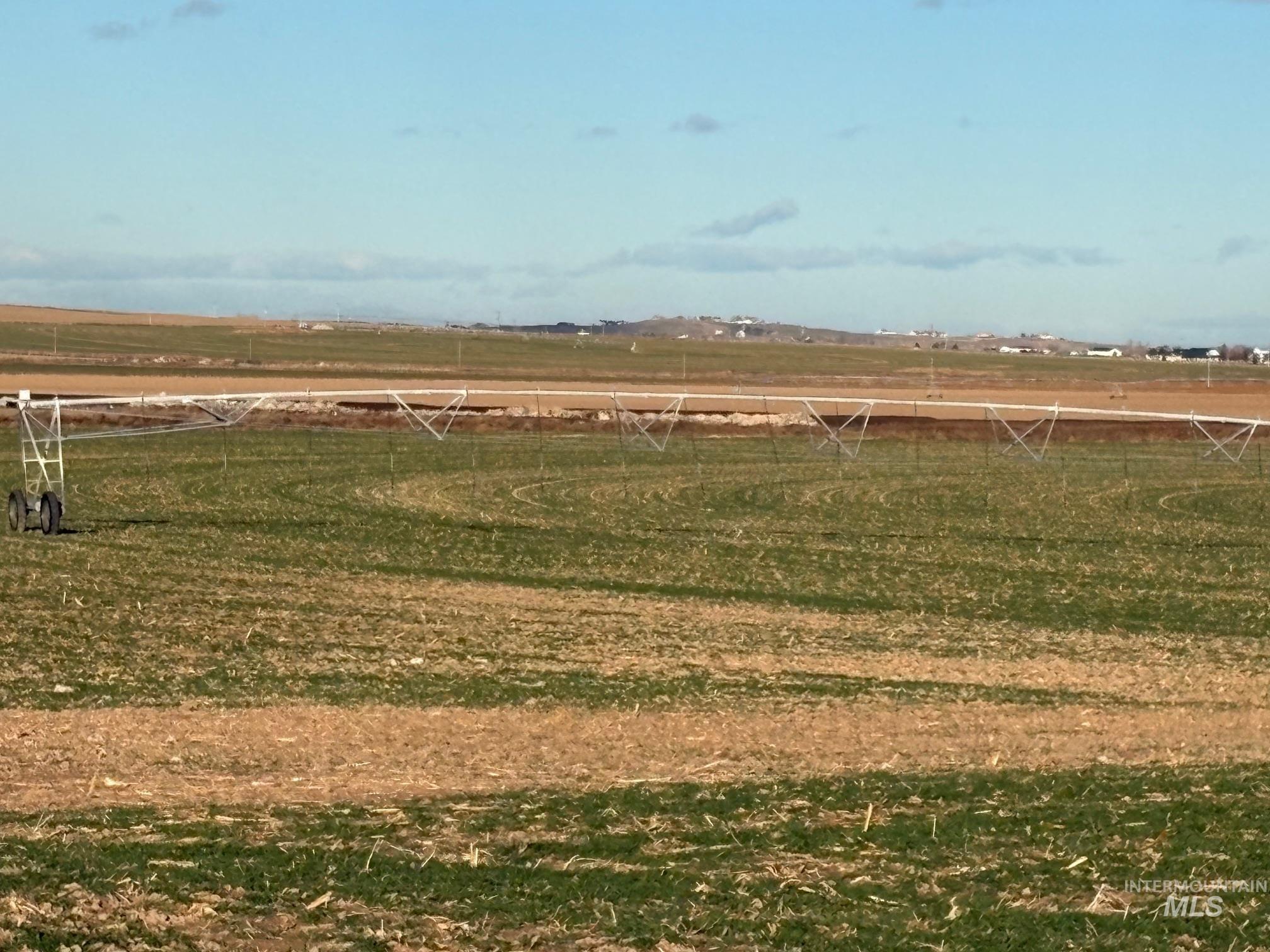 View of yard featuring a view of rural / pastoral area and a sport area