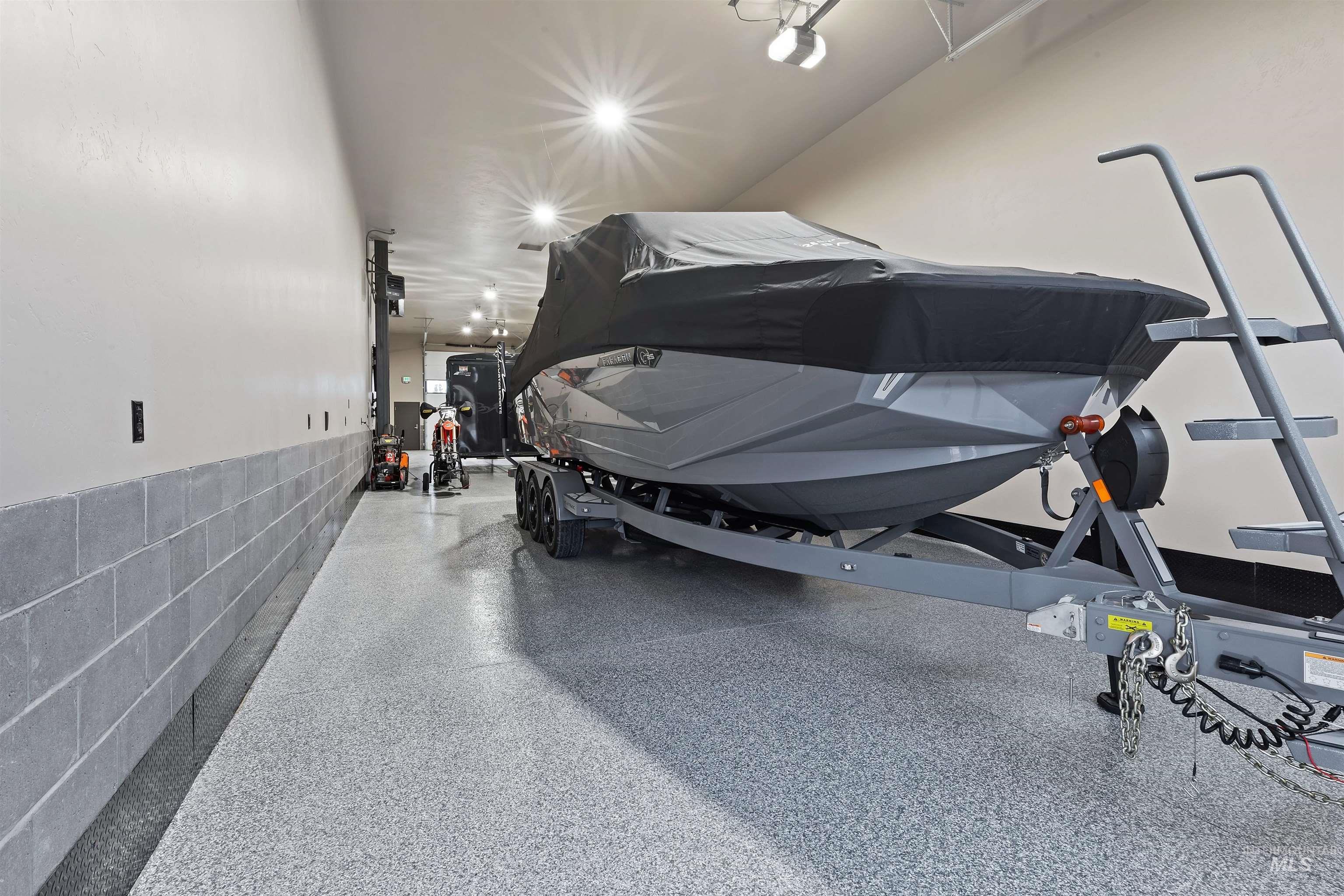 Garage featuring concrete block wall