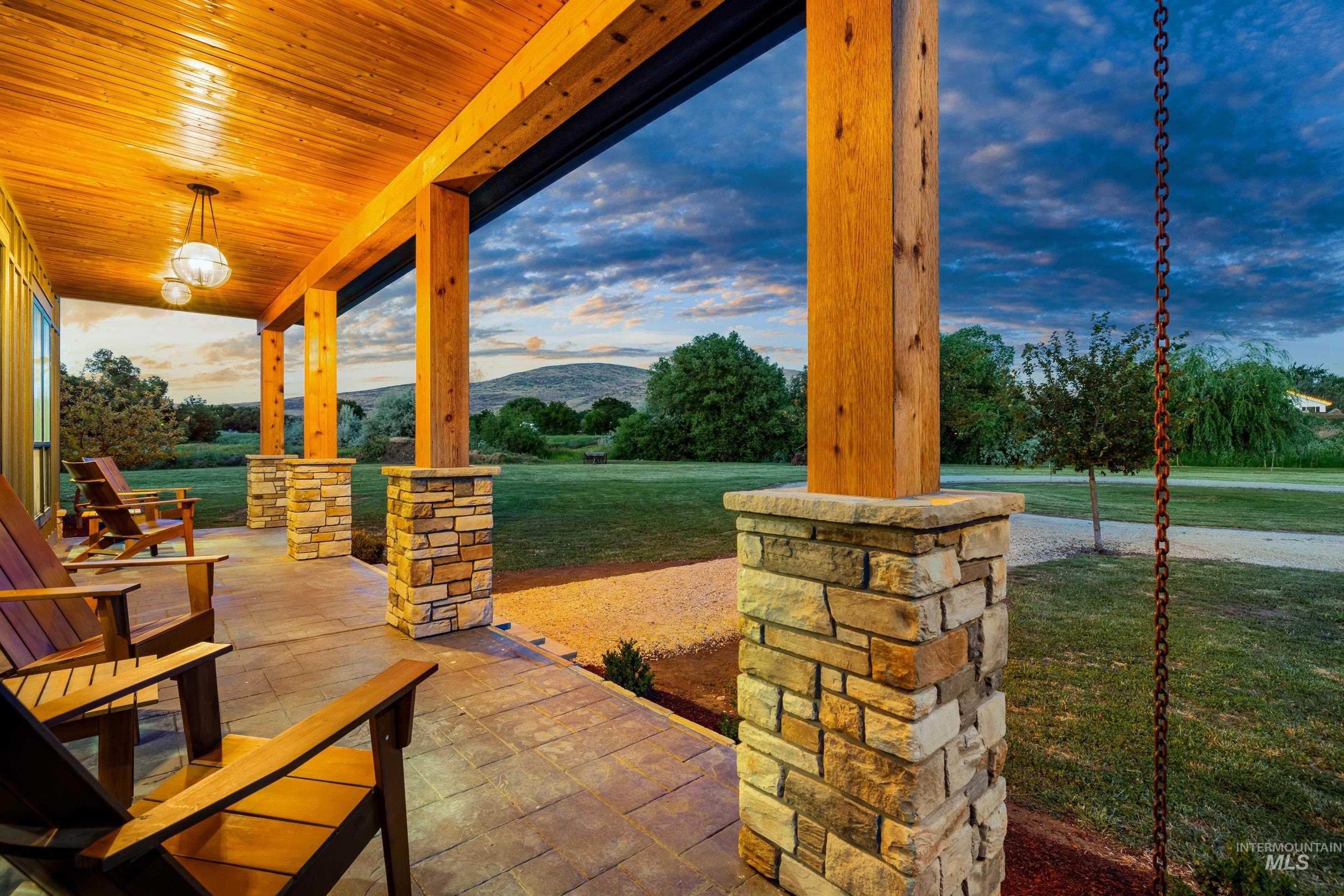 Porch featuring a mountain view and a yard
