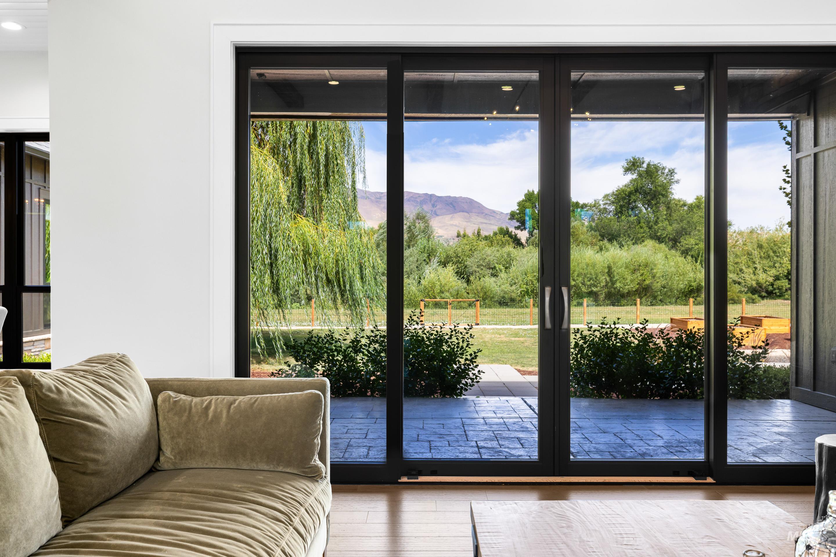 Entryway with healthy amount of natural light, wood finished floors, and a mountain view