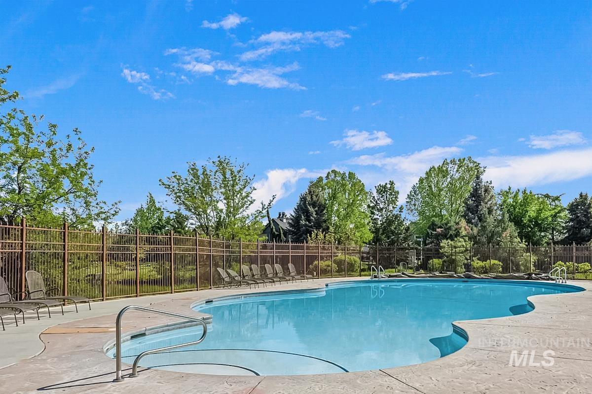 Community pool with a patio area
