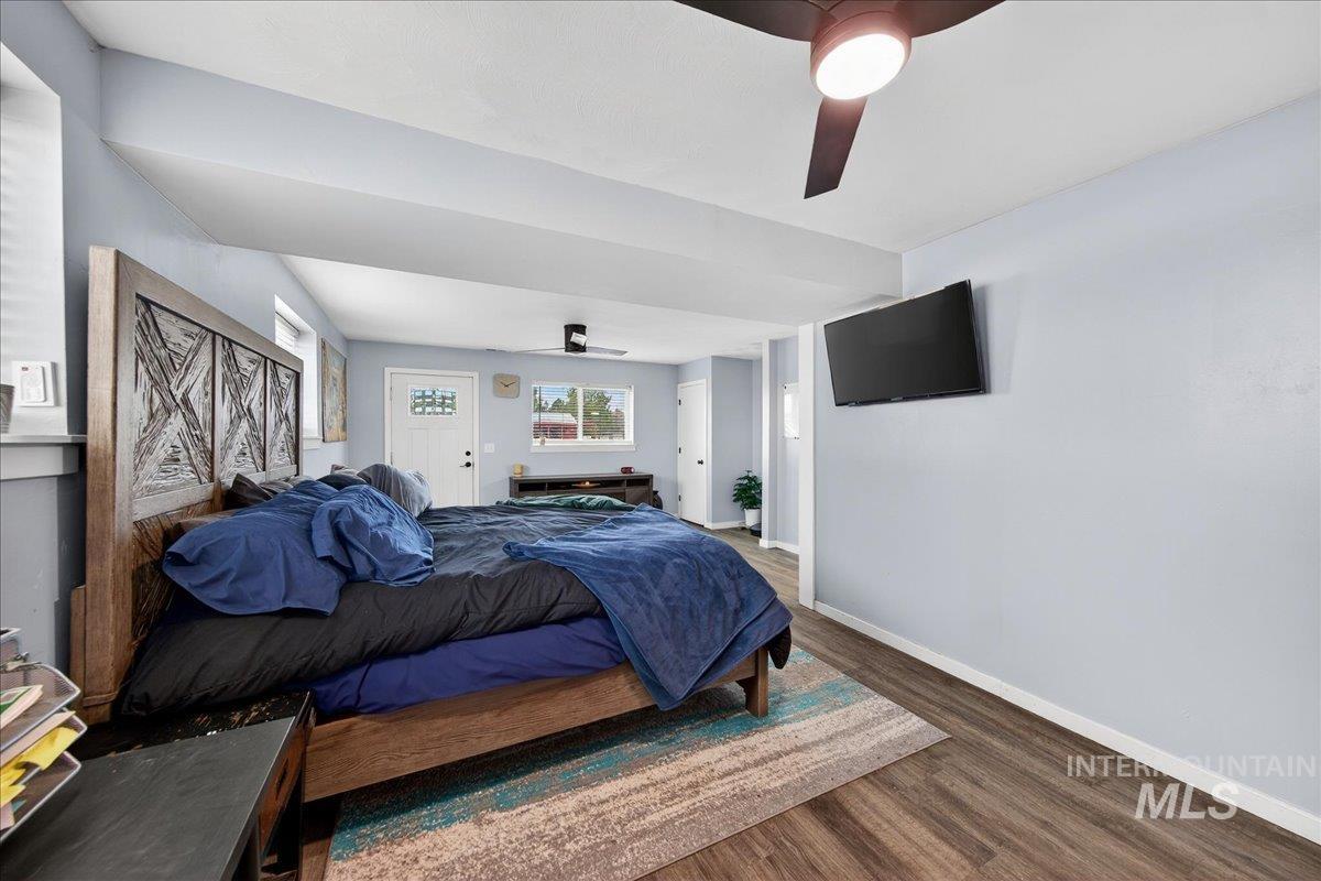 Bedroom with wood finished floors and a ceiling fan