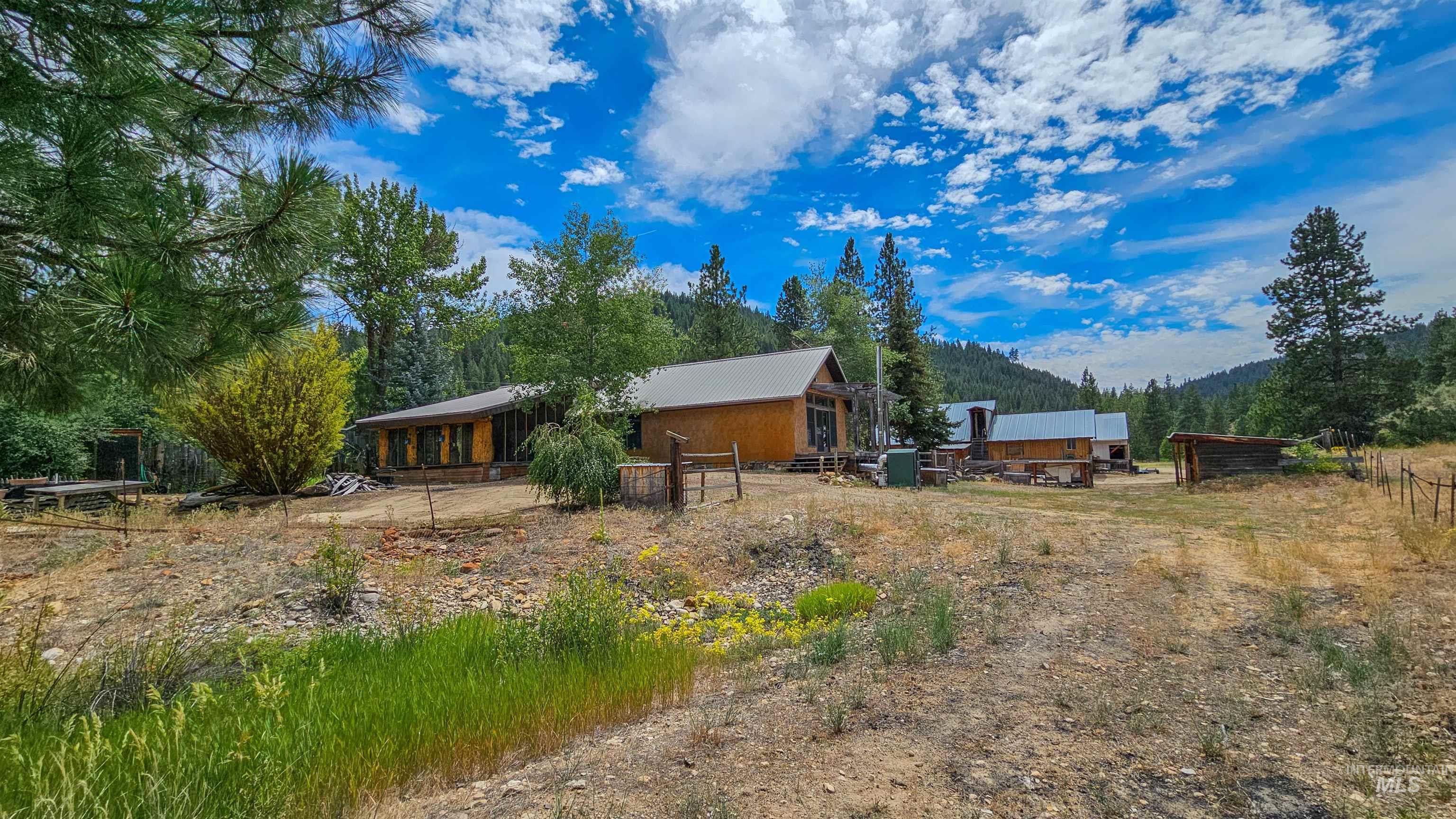 Back of house featuring a mountain view