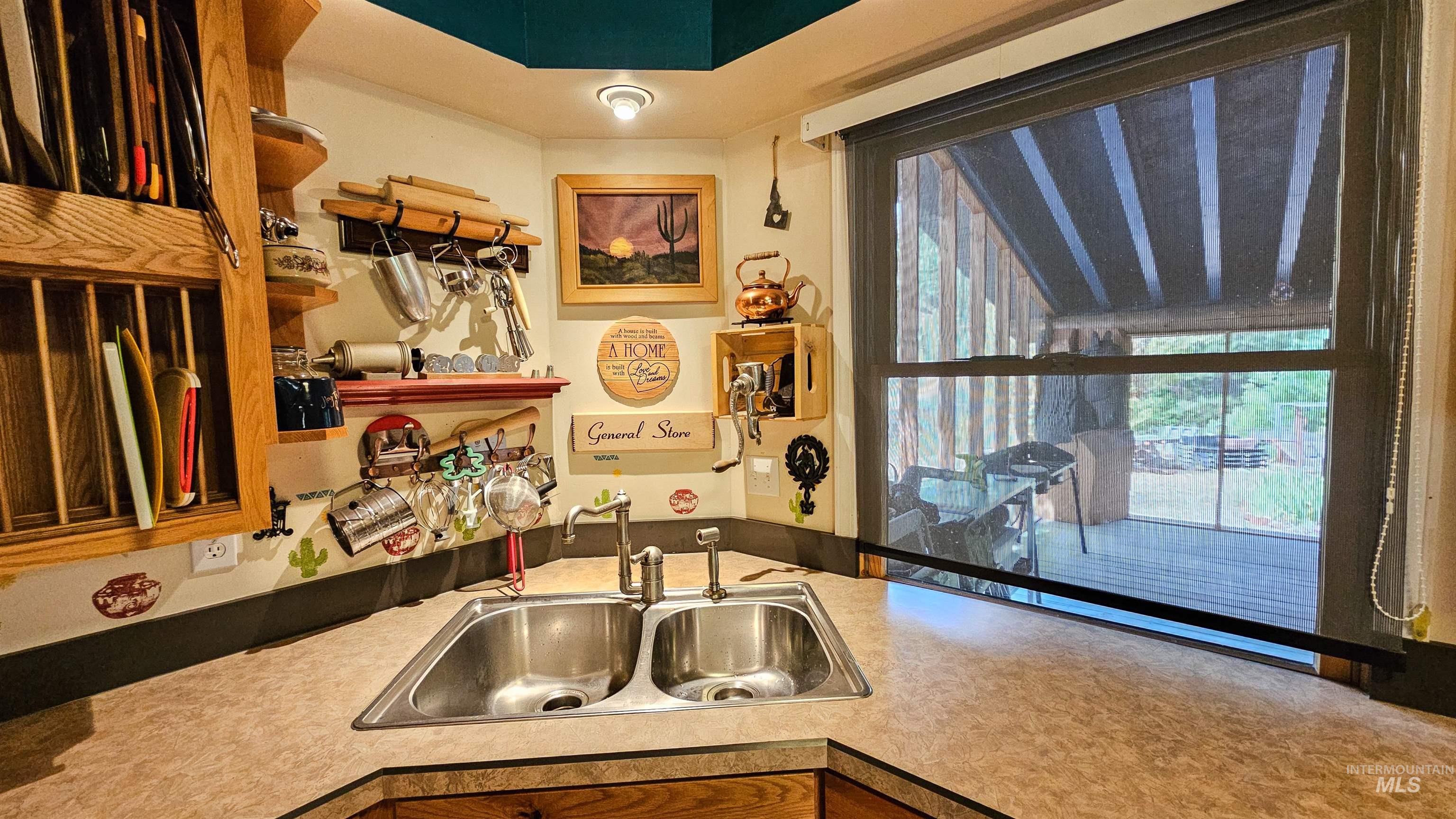 Kitchen featuring a sink and light countertops
