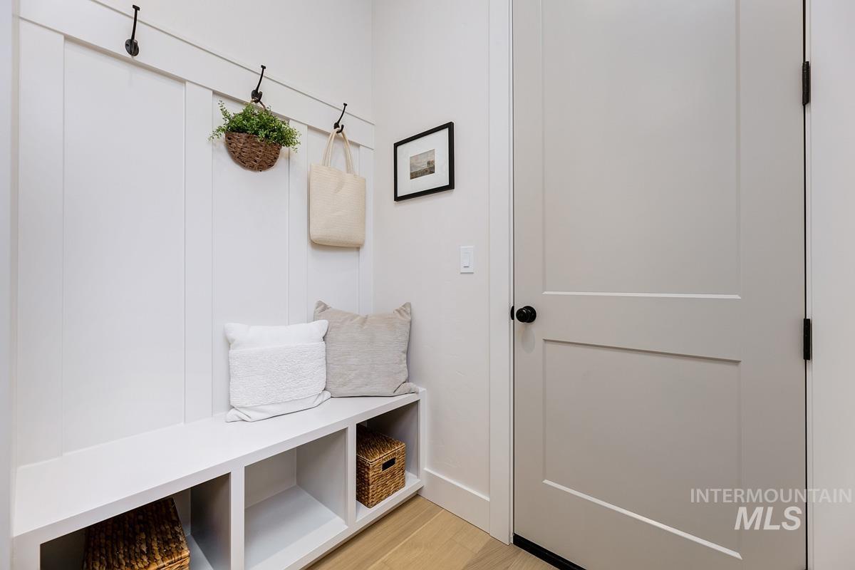Mudroom with light wood-style floors