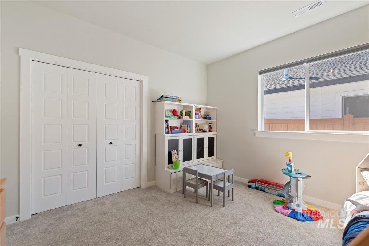 Playroom featuring carpet and baseboards