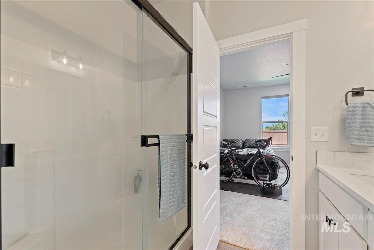 Full bathroom with a stall shower and vanity