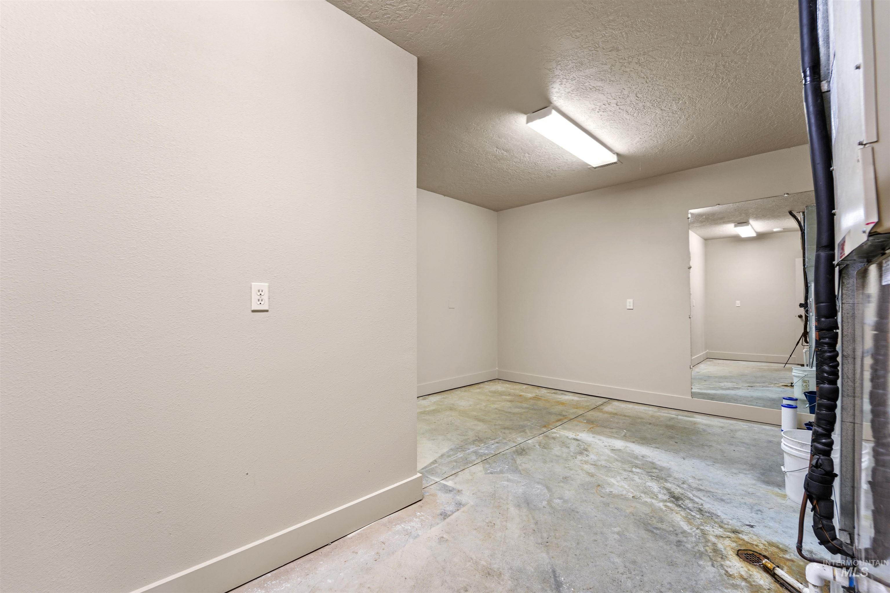 Garage featuring baseboards