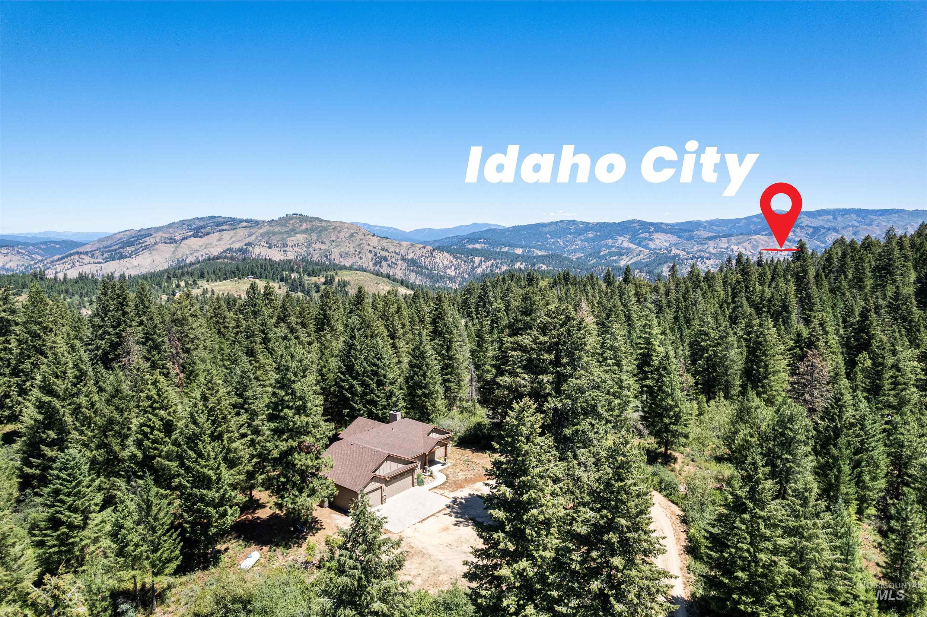 View of subject property featuring a heavily wooded area