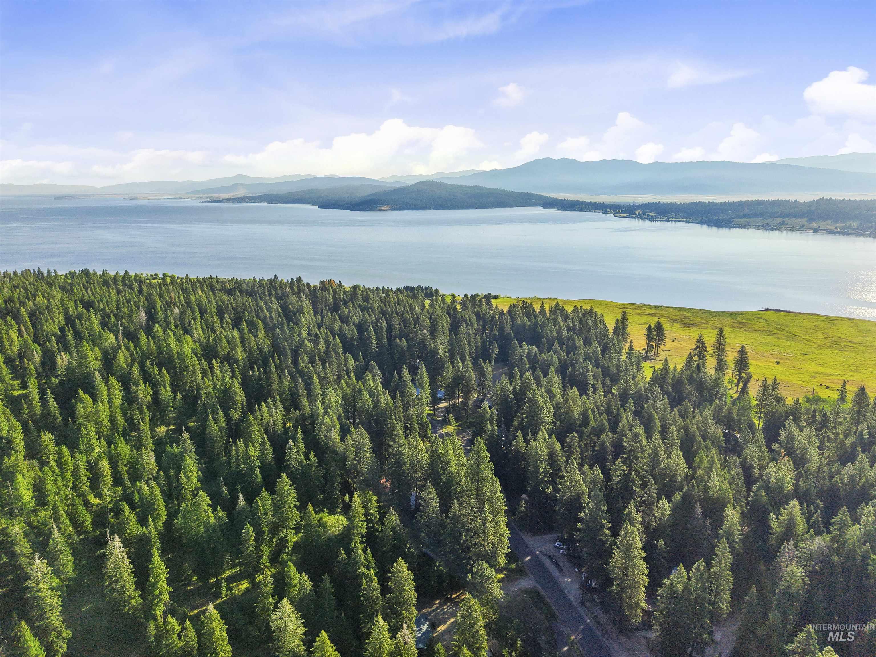 View of mountain backdrop featuring a nearby body of water