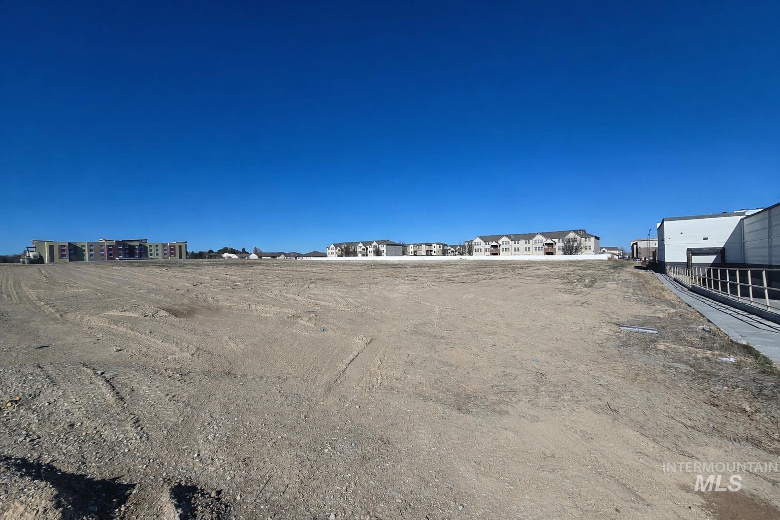 View of parking with a residential view