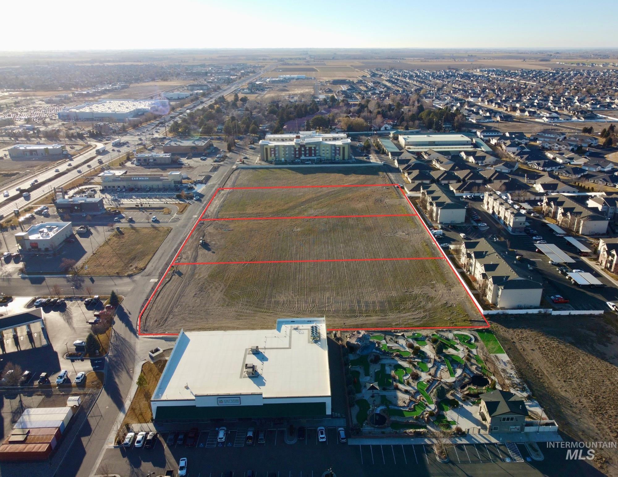 Aerial overview of property's location featuring property parcel outlined