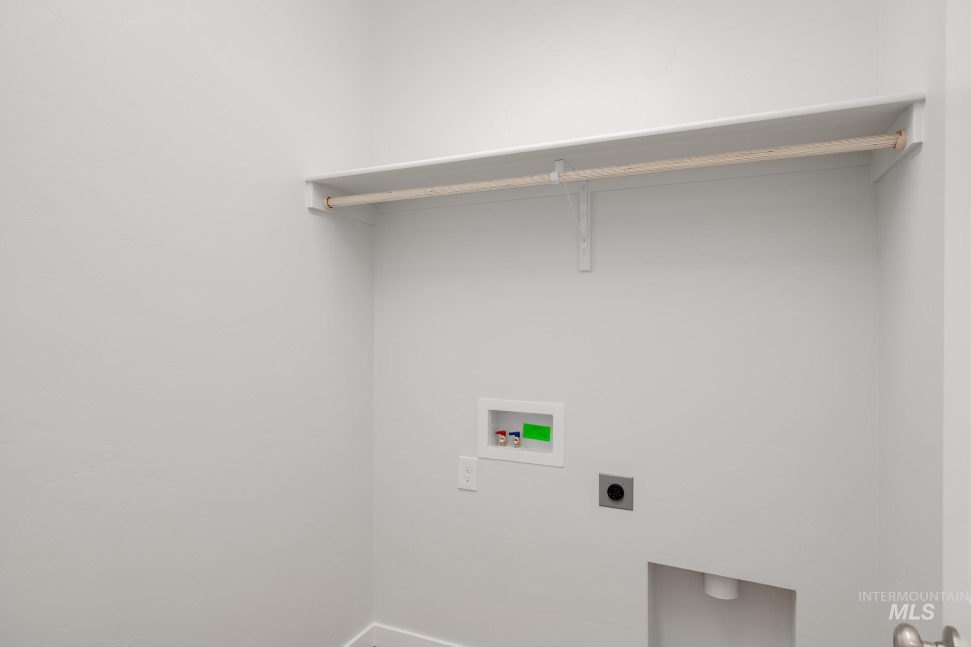 Laundry area with washer hookup and electric dryer hookup