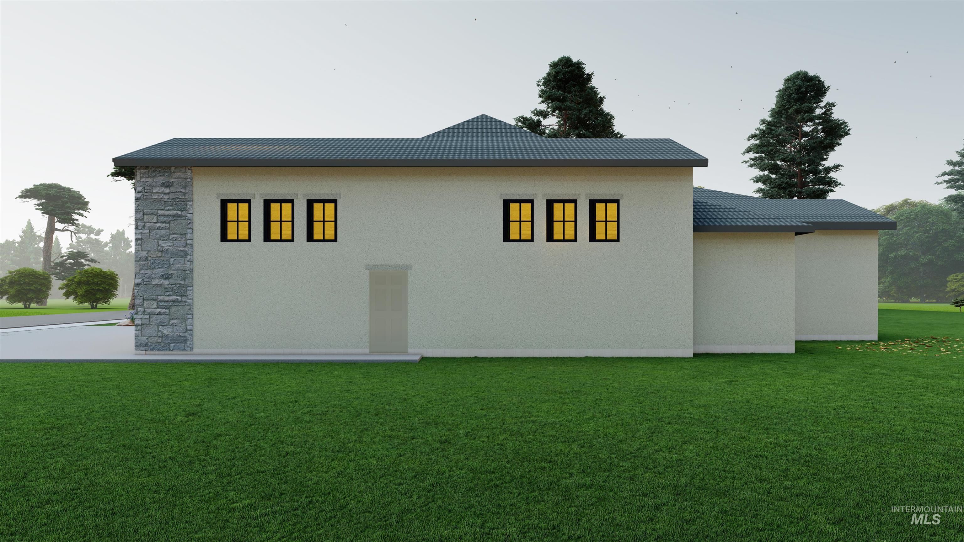 View of home's exterior with a lawn, stucco siding, and stone siding