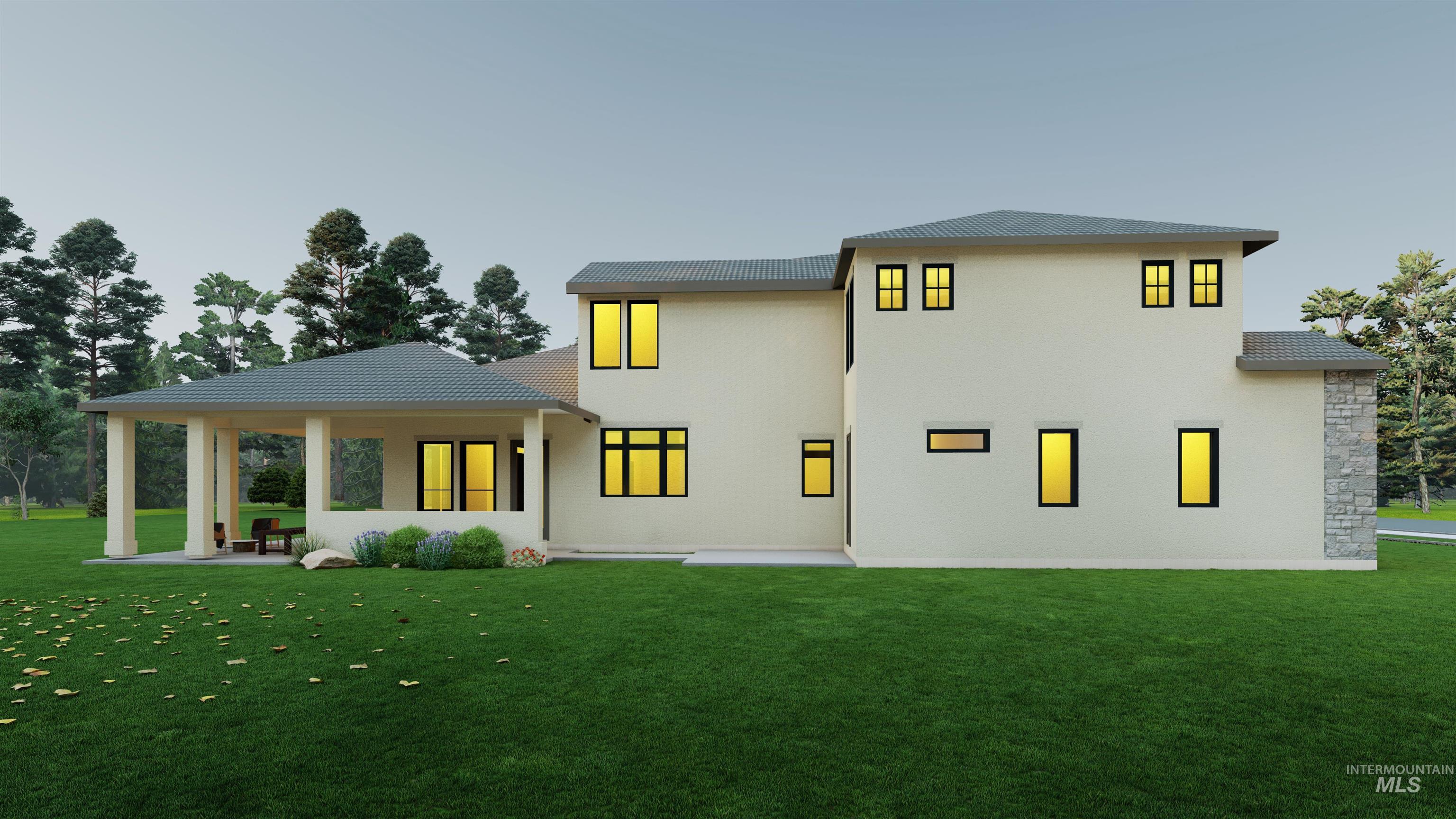Rear view of house with a lawn and stucco siding
