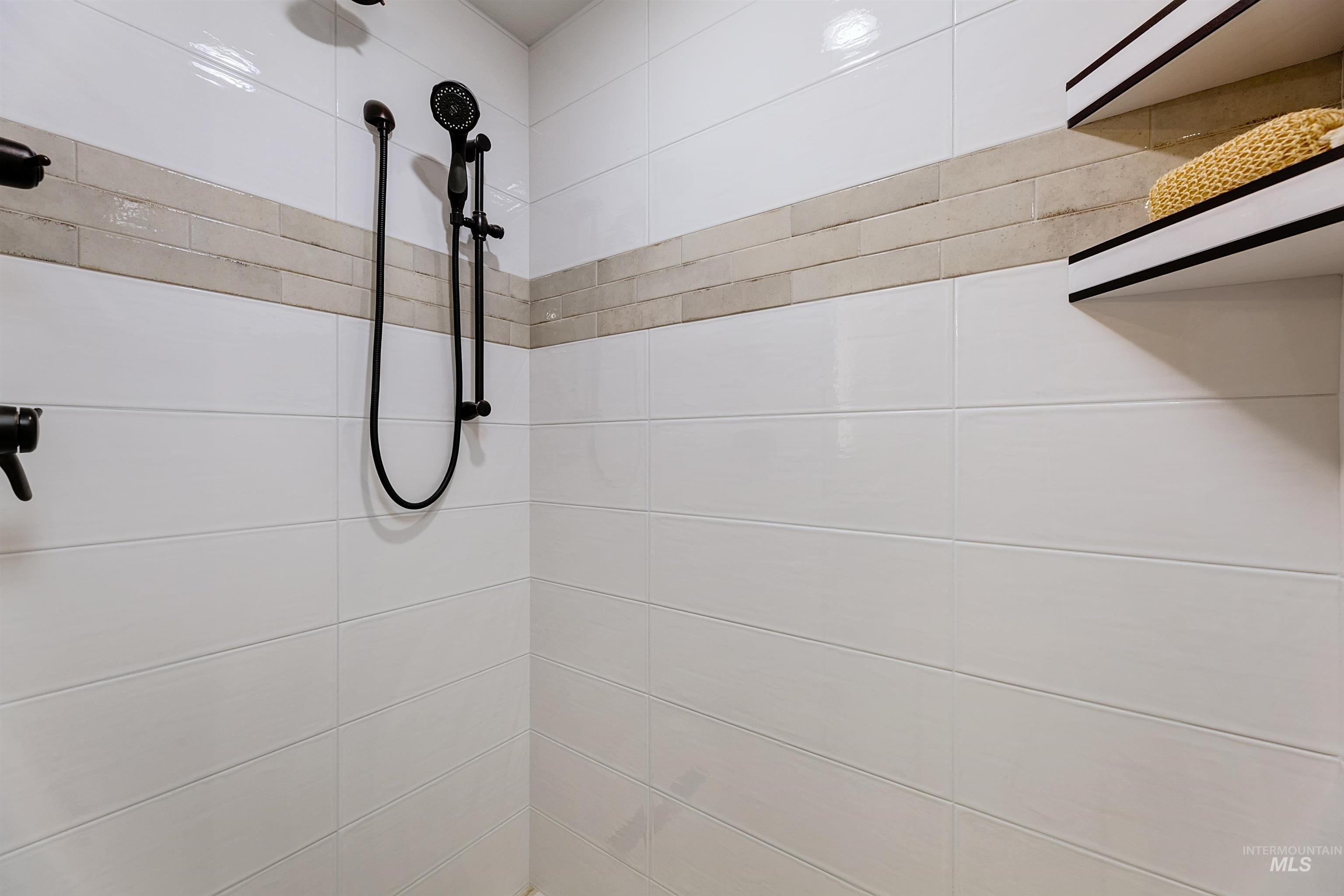 Full bath with tiled shower