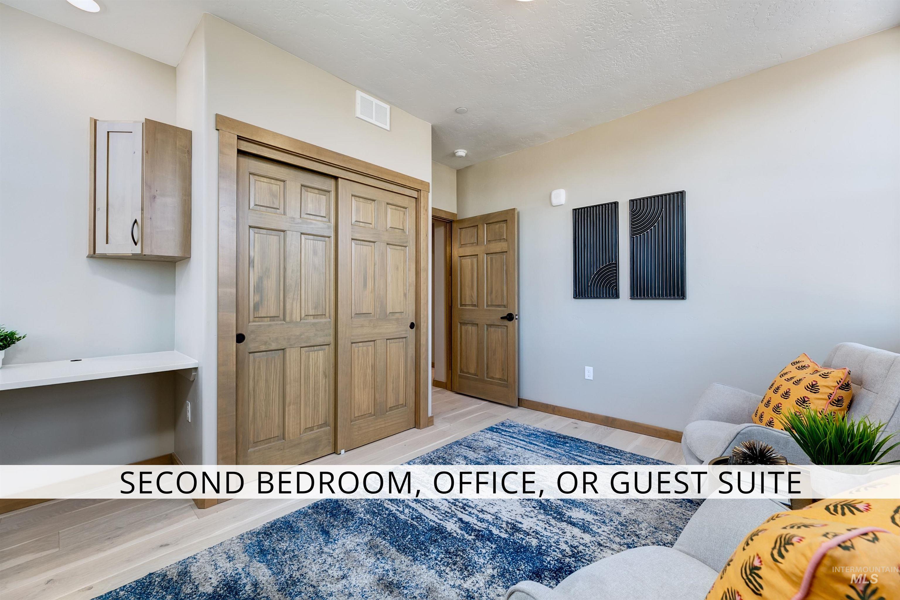 Bedroom featuring light wood-type flooring and a closet