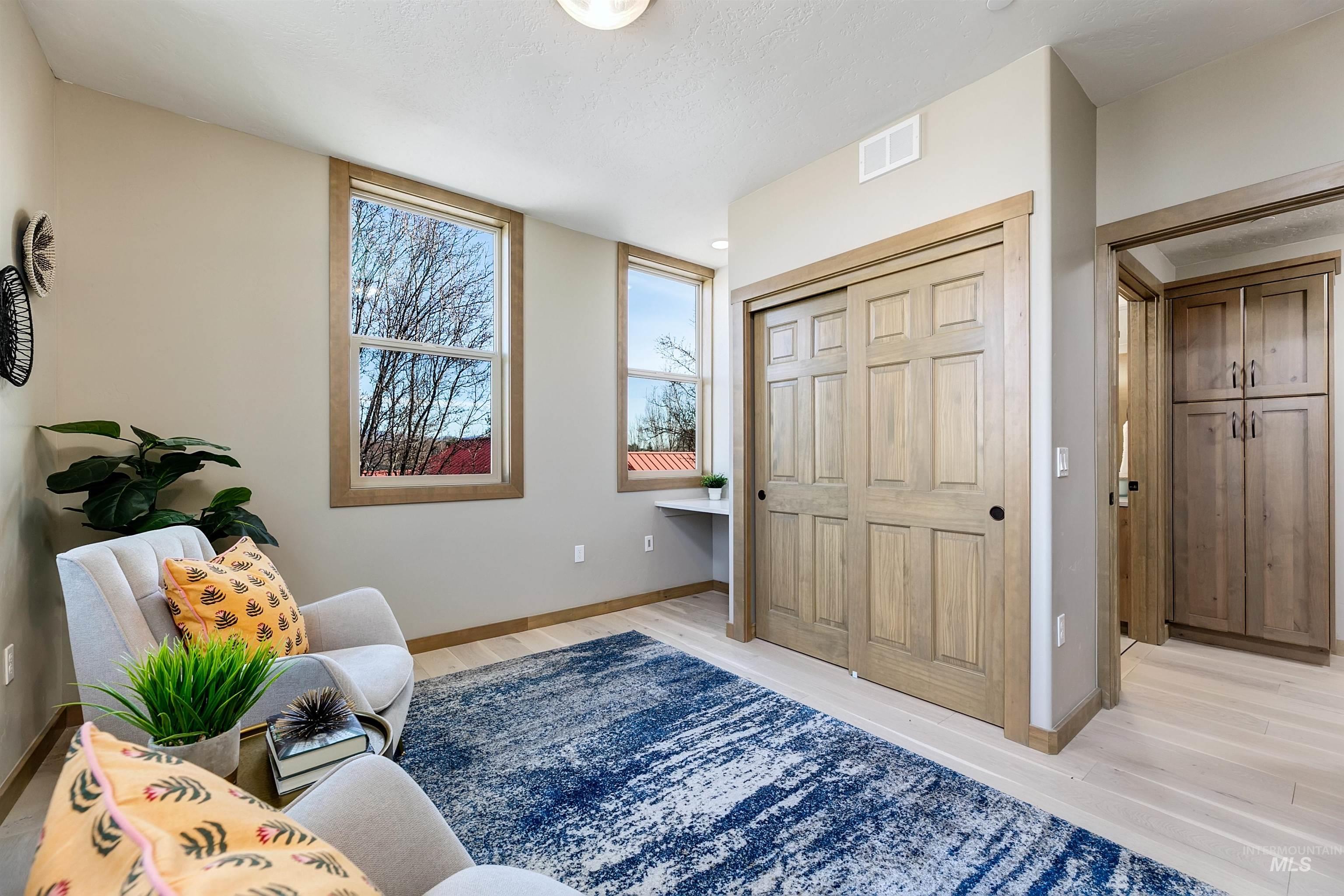 Sitting room with light wood-type flooring
