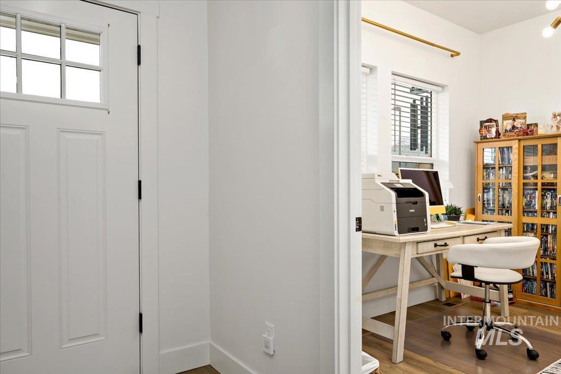 Office area featuring wood finished floors and baseboards