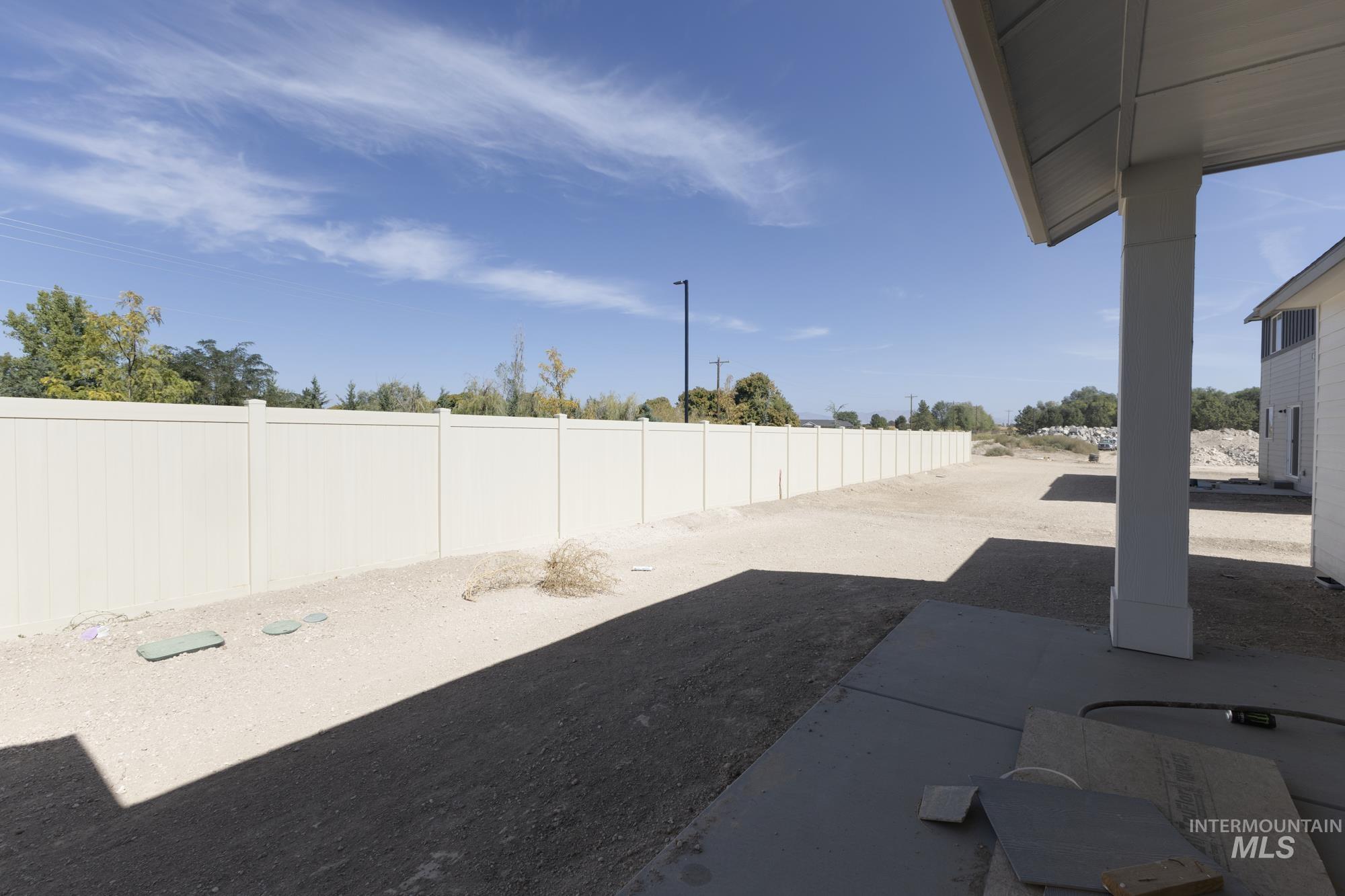 Fenced backyard featuring a patio