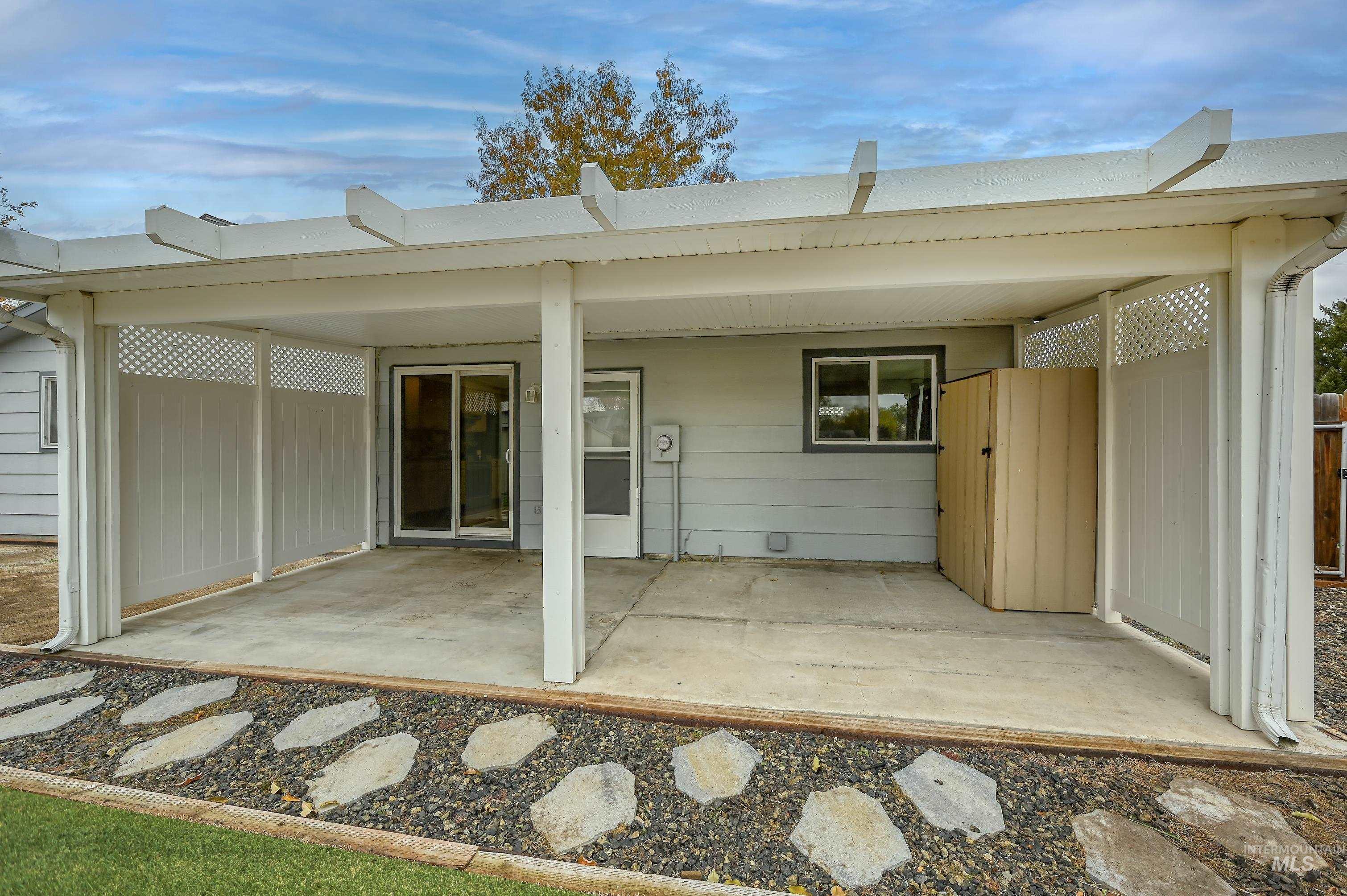 Rear view of property with a patio area