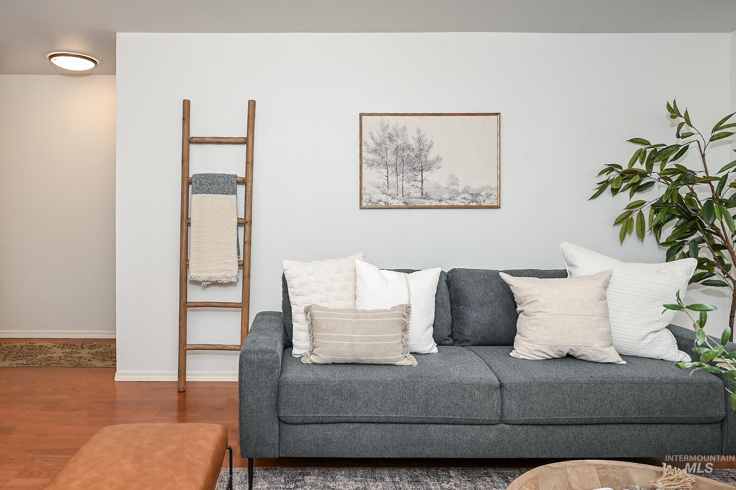 Living room featuring wood finished floors and baseboards