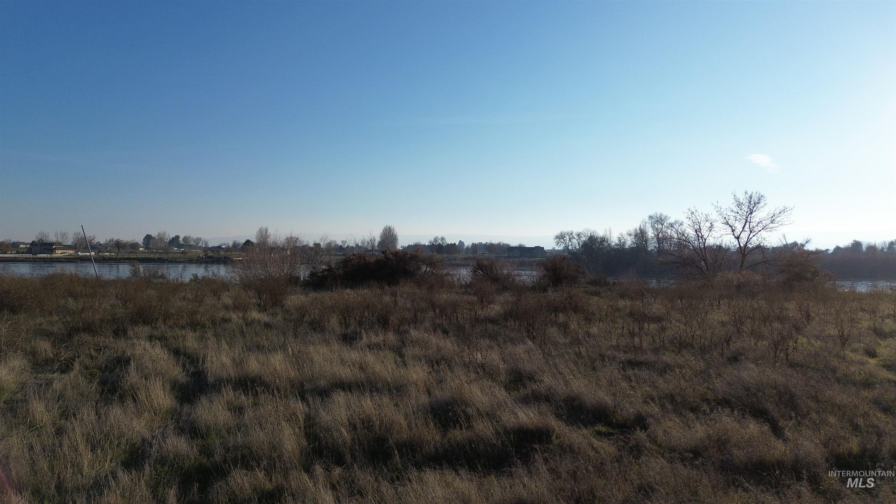 View of undeveloped land featuring a large body of water